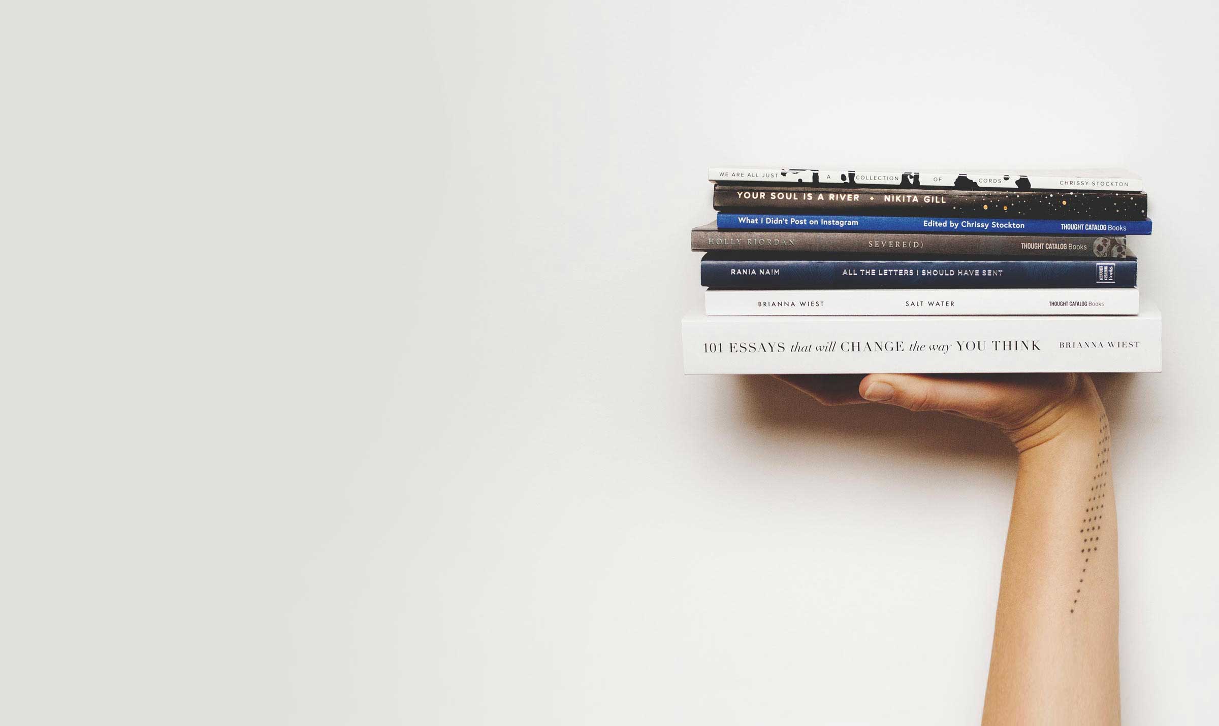 Tablo masthead holding books